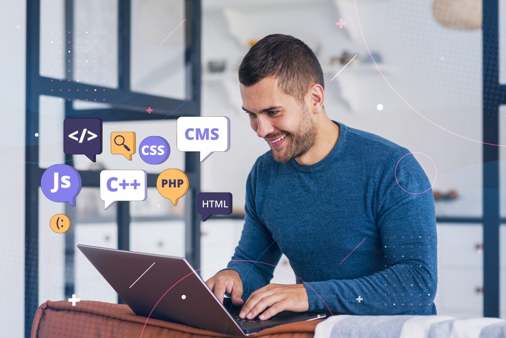 A smiling developer working on a laptop with floating 3D icons representing HTML, CSS, JavaScript, PHP, C++, and CMS, representing modern web development companies in Dubai.